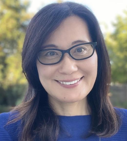 Woman in glasses and a blue shirt