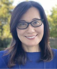Woman in glasses and a blue shirt