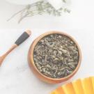 A photo of tea leaves in a small bowl.